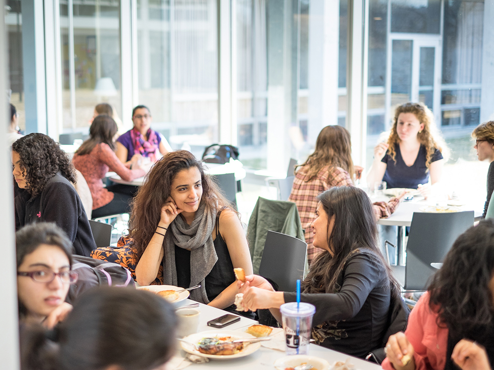 Two students chatting in the Cutter-Ziskind dining room