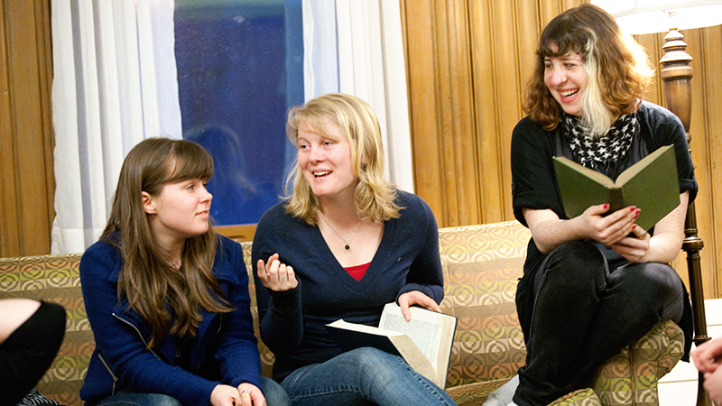 Students sitting on couch having a discussion