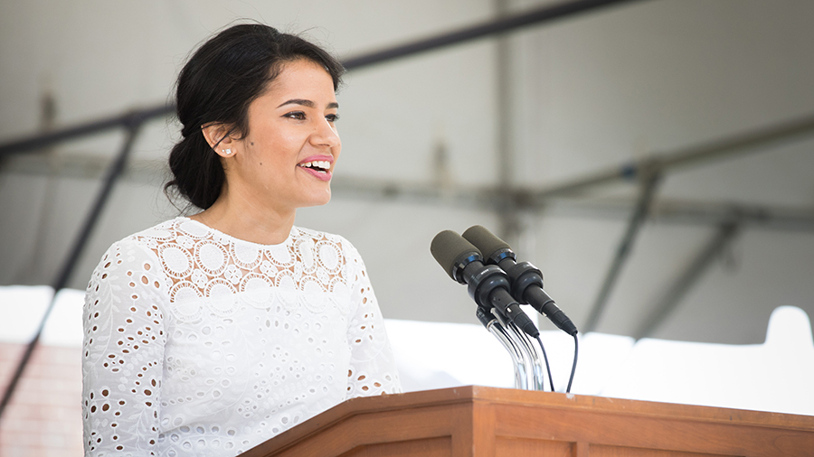 Ingrid Magalhaes speaking at the podium