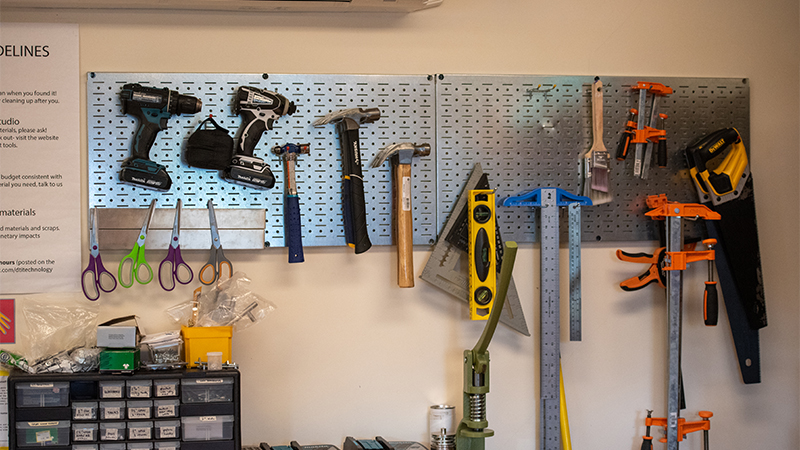 Various hand tools hanging on the wall