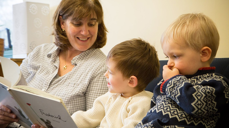 Teacher reading to two children