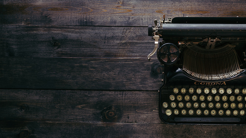 image of a typewriter on a wooden background