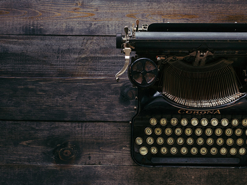 Black Typewriter on dark wood