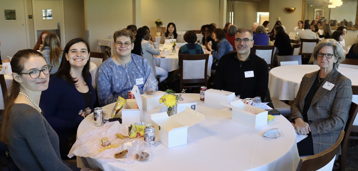 Attendees eating lunch in the conference center.