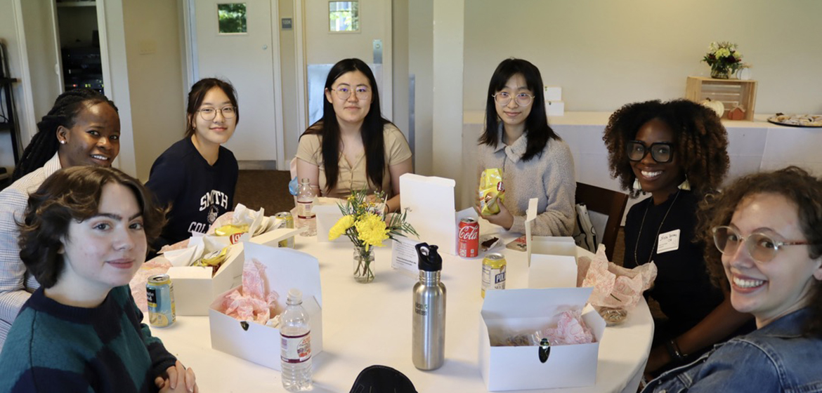 Attendees eating lunch in the conference center.