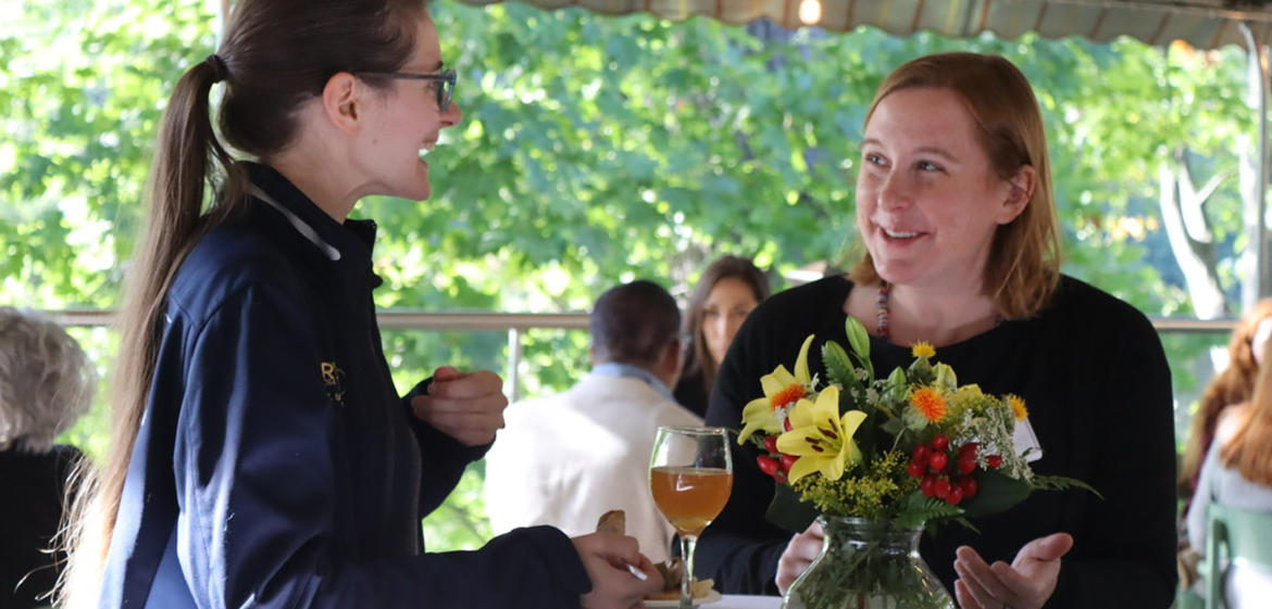 Attendees talking outside at the psychology centennial symposium