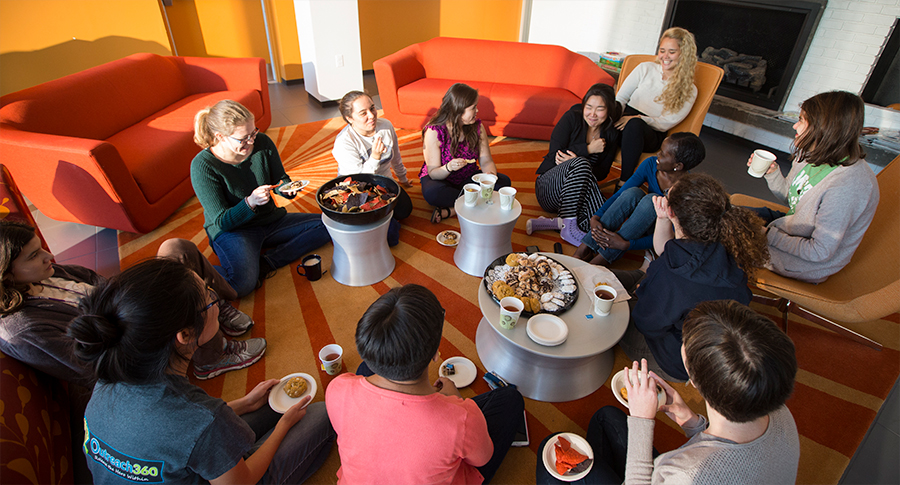 Group of students having tea and snacks