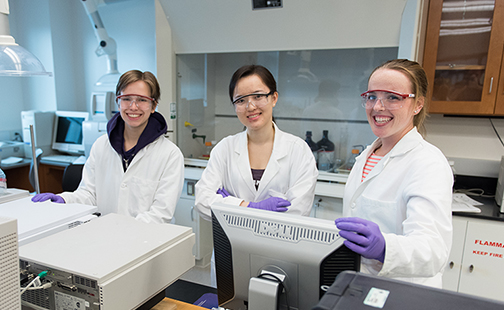 Three students in a lab in Ford Hall