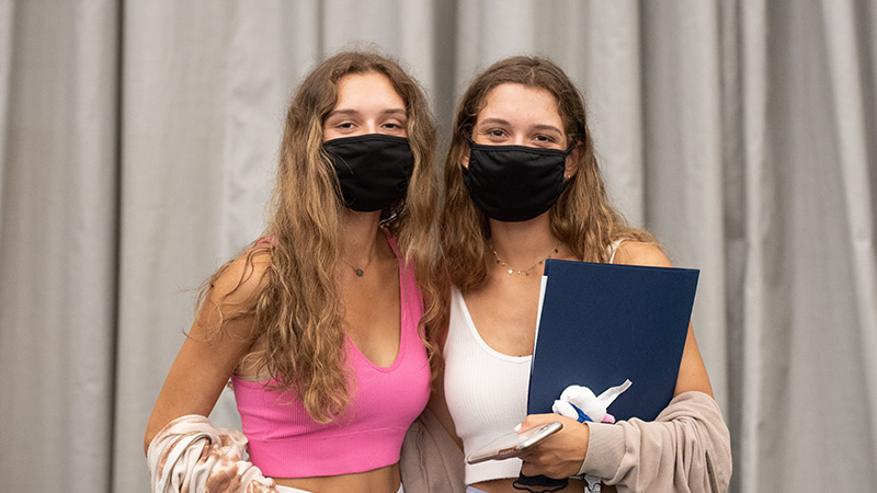 Two new students at arrival and central check-in