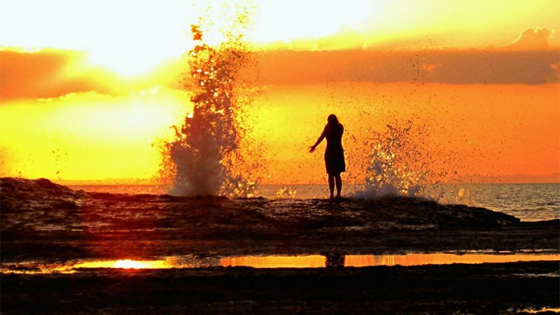 Photo of a student standing near the water in Costa Rica