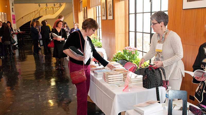 Women registering for an event in the Alumnae House Gallery