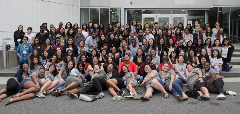 Group photo of Bridge participants in front of the campus center