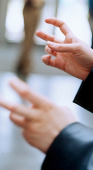 Close up of a student speaking in sign language