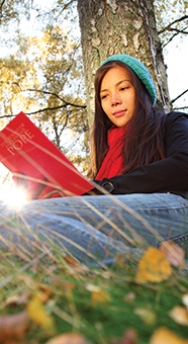 Woman reading under a tree