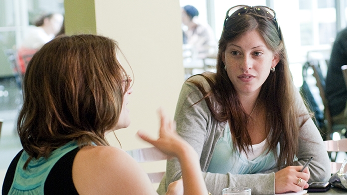 Student talking with a faculty member