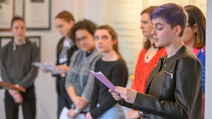 Image of students reading poetry