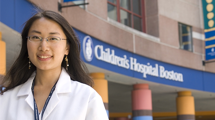 Student posing in front of children's hospital