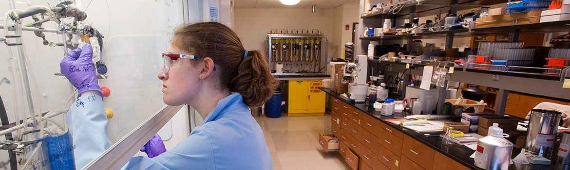 Student conducting research with science equipment