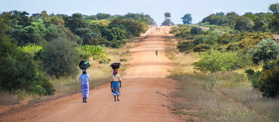 African women walking on a road