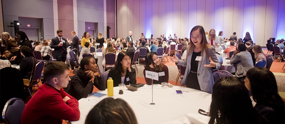 Students at a table at an event