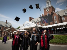 2019 graduates throwing hats