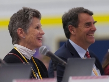 Melisa Parker and Tim Draper smiling during a presentation