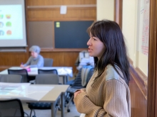 Luca Jacodine standing at a white board speaking to a classroom