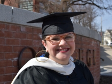 Marcela Rodrigues in front of the Smith College brick sign