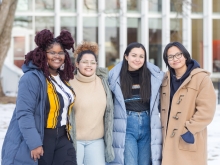 Four students outside the Smith campus center