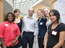 Five students and a faculty member in the Campus Center