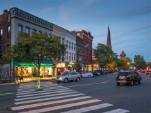 A crosswalk in downtown Northampton with cars driving by