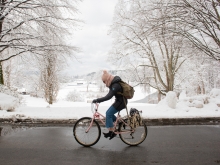 Riding a bike through a snowy landscape