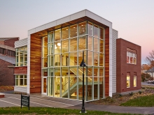 glass and wood building against blue sky