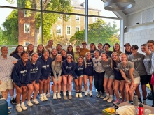 Smith soccer players pose with soccer star Abby Wambach and her wife, Glennon Doyle