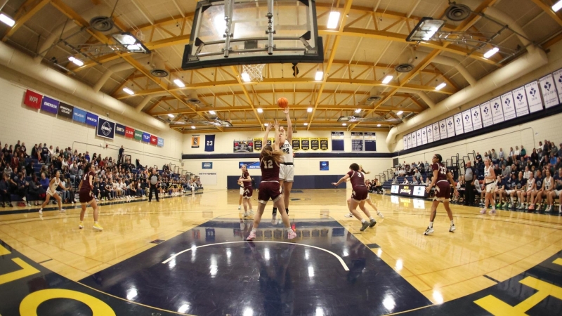 A Pioneer makes a shot during a basketball game