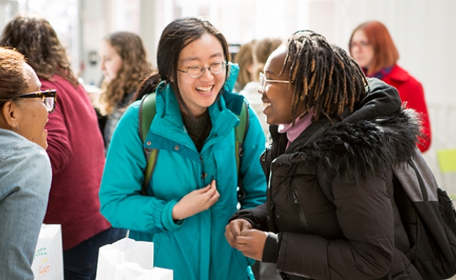 Two students at the Wheel of Engagement activity at the Campus Center