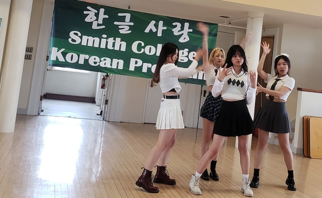 Four students participate in a k-pop dance.