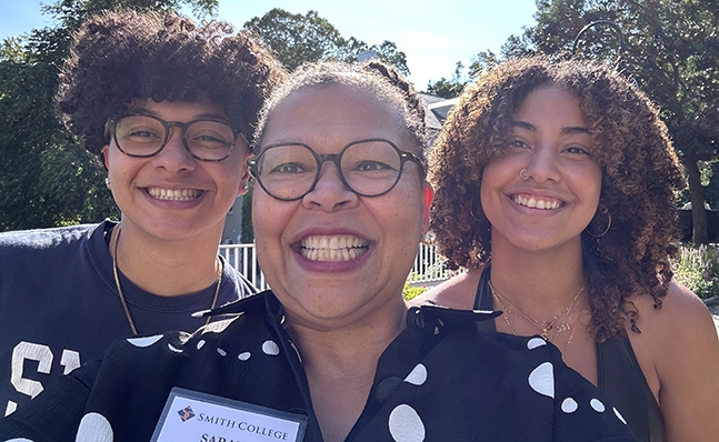 Sarah Willie-LeBreton, in a selfie with two students.