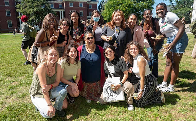 President Sarah Willie-LeBreton on Chapin Lawn with students.