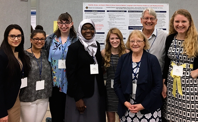 A group of students posing with one of their posters at the Society for Research in Child Development (SRCD) Convention in Austin TX in April 2017. 